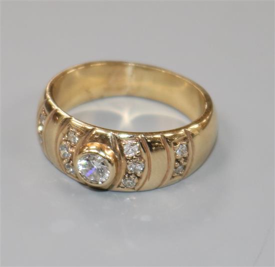 A 9ct gold and diamond set dress ring, size M.